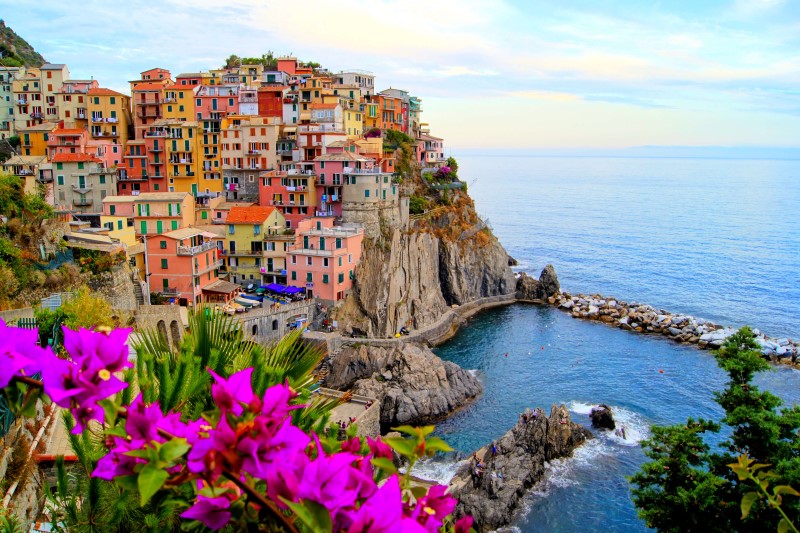 shutterstock_100984339_Village-of-Manarola,-on-the-Cinque-Terre-coast-of-Italy-with-flowers